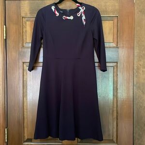 Navy dress with R-W-B scarf at neckline